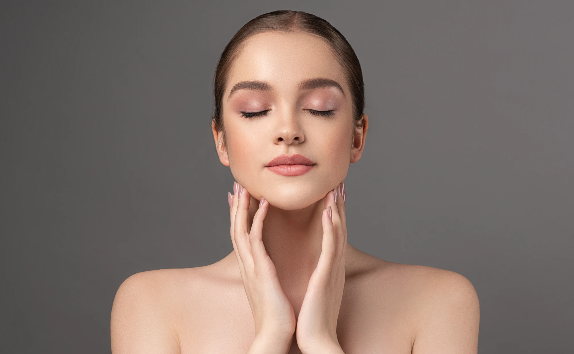 Close-up of a woman receiving a Salmon Sperm Facial for glowing, youthful, and radiant skin
